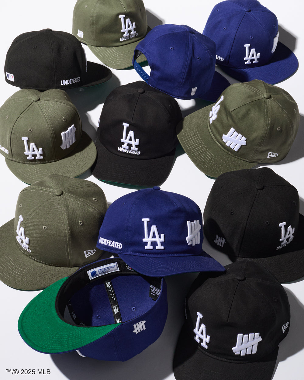 Collection of baseball caps with various colors and LA logos and five strike logos on a white background