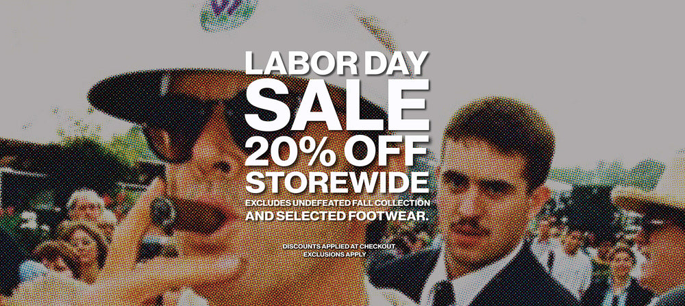 Labor Day sale promotional banner with large white text reading 'LABOR DAY SALE 20% OFF STOREWIDE' over a faded outdoor photo of people, including a man in a hat and sunglasses in the foreground.