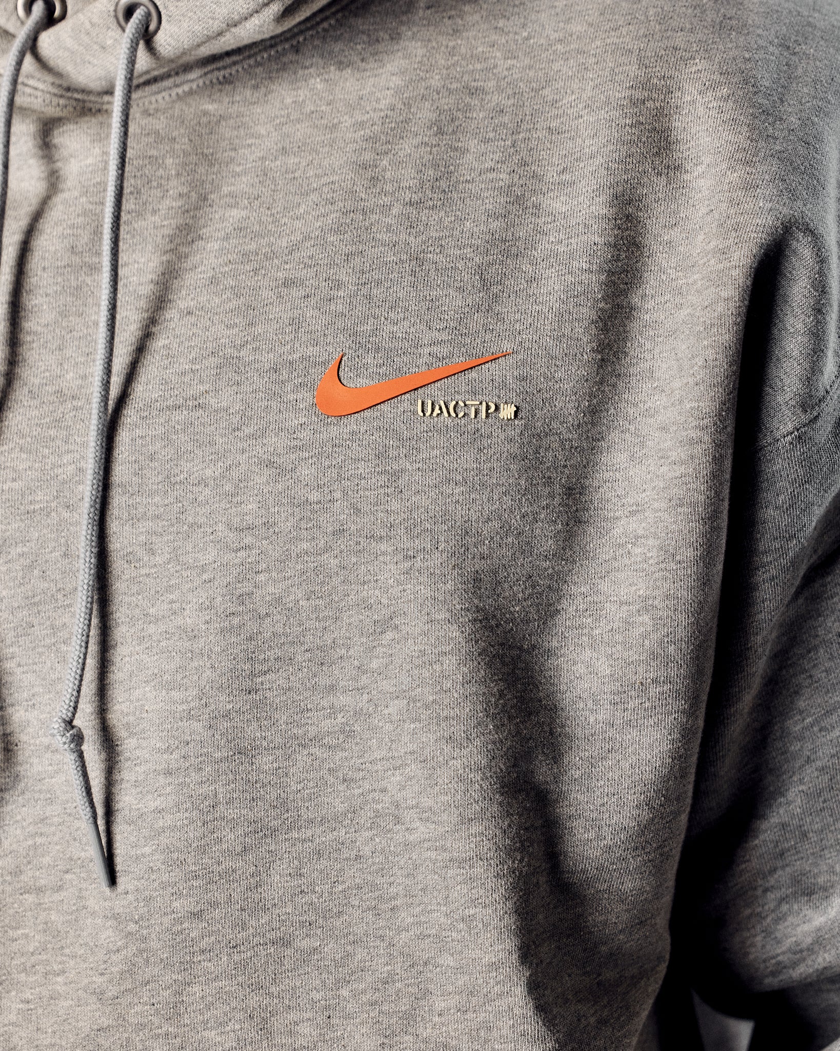 UACTP X NIKE NRG HOODIE - DK GREY HEATHER – Undefeated