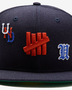 UNDEFEATED X NE ALL OVER FITTED – Undefeated