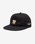 BLACK::A black Undefeated Icon Herringbone Snapback on a white background.