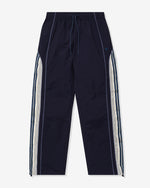 NAVY::A navy Undefeated paneled Track Pant on a white background.