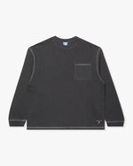 BLACK::A black Undefeated Pigment Dye L/S Pocket tee on a white background.