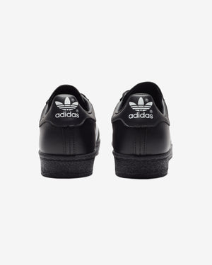 ADIDAS SUPERSTAR 82 CBLACK FTWWHT Undefeated